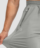 men's drawstring with 3 zipper pockets pant in bright gray - stretchy fabric details view
