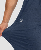 men's drawstring with 3 zipper pockets pant in heathered academy blue - stretchy fabric details view