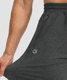 men's drawstring with 3 zipper pockets pant in heathered black - stretchy details view