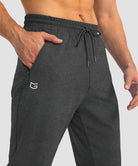 men's drawstring with 3 zipper pockets pant in heathered black - zipper pocket detail view