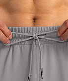men's drawstring with 3 zipper pockets pant in light gray - waistband detail view