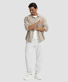 men's fleece-lined cotton joggers in grayish white - front view