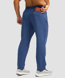men's fleece-lined zip pockets stretch sweatpants in blue - back view
