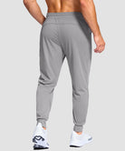 men's mid-rise with pockets stretchy joggers in light gray - back view