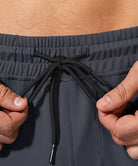 men's mid-waist zipper pockets jogger in gray - waist detail view