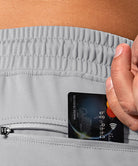 men's mid-waist zipper pockets jogger in light gray - pocket details view