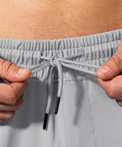 men's mid-waist zipper pockets jogger in light gray - waist detail view