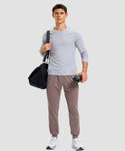 men's static-free stretch athletic joggers in heather dark pink - front view