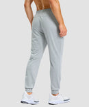 men's static-free stretch athletic joggers in heather light gray - back view