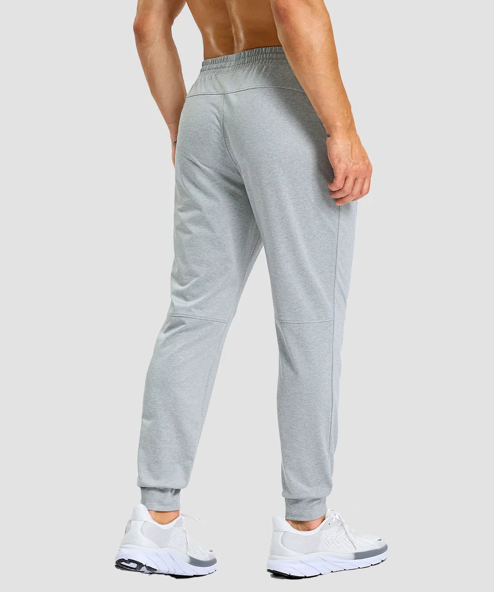 men's static-free stretch athletic joggers in heather light gray - back view