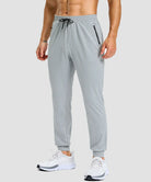 men's static-free stretch athletic joggers in heather light gray - front view