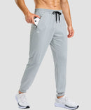 men's static-free stretch athletic joggers in heather light gray - zipper pocket detail view