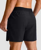 mid rise elastic waist slit short 5" in black - back view