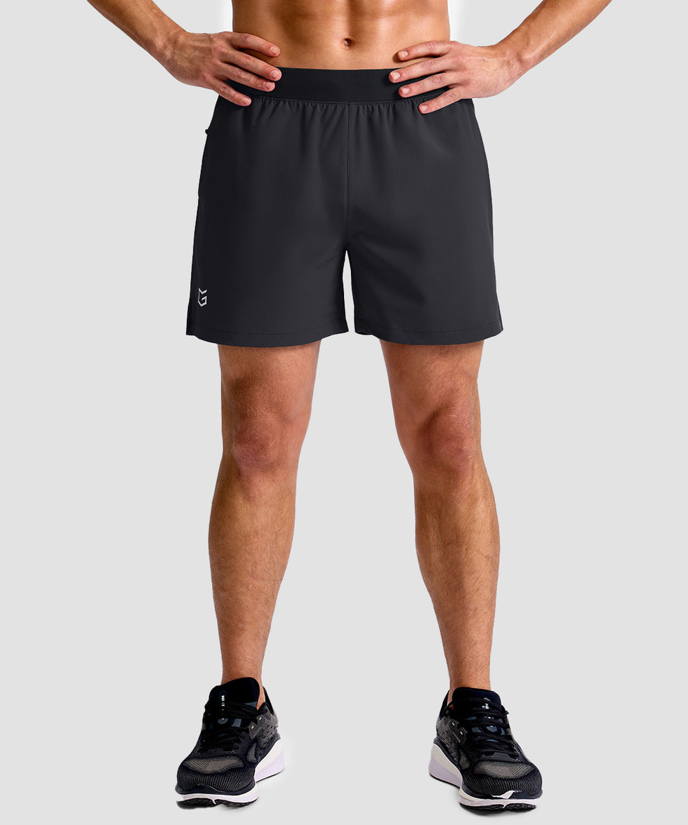 mid rise elastic waist slit short 5" in black - on model front view