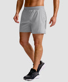 mid rise elastic waist slit short 5" in bright gray - on model side view