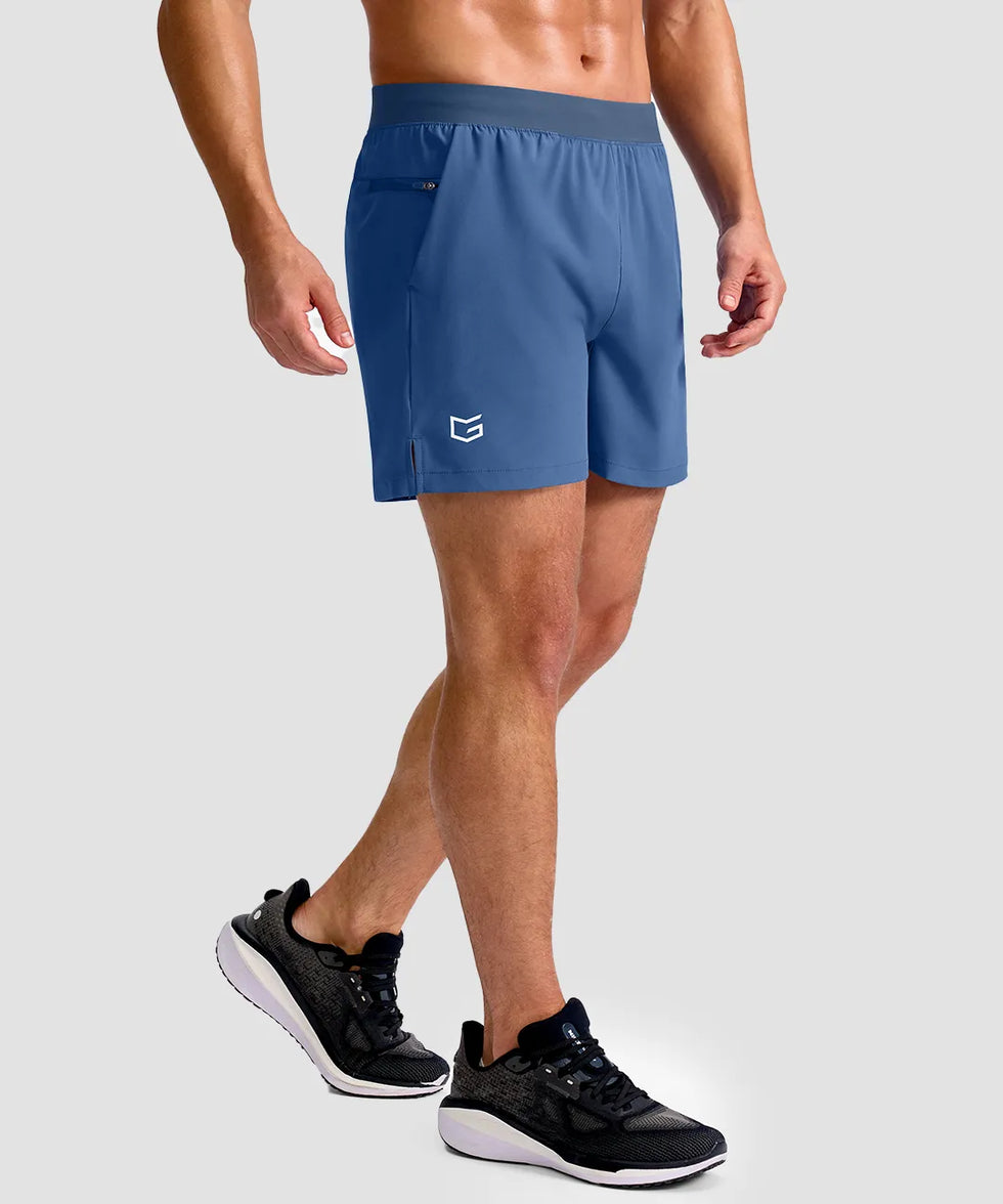 mid rise elastic waist slit short 5" in dusty blue - on model side view