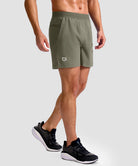 mid rise elastic waist slit short 5" in gray sage - on model side view