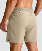 mid rise elastic waist slit short 5" in light khaki - back view