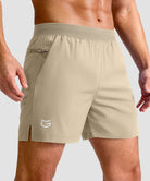 mid rise elastic waist slit short 5" in light khaki - front view