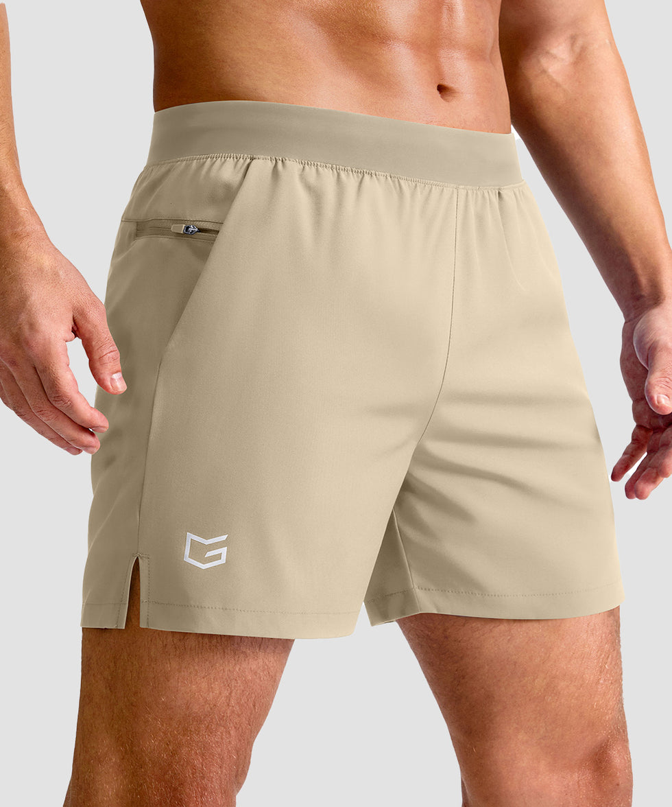 mid rise elastic waist slit short 5" in light khaki - front view