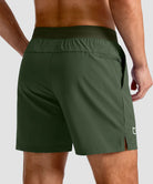 mid rise elastic waist slit short 5" in olive green - back view