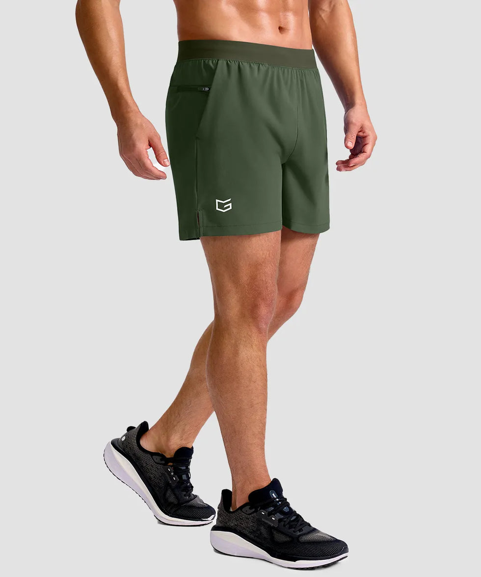 mid rise elastic waist slit short 5" in olive green - on model side view