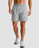 mid rise elastic waist slit short 7" in bright gray - on model front view