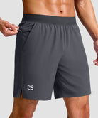 mid rise elastic waist slit short 7" in dark gray - front view