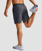 mid rise elastic waist slit short 7" in dark gray - on model back view