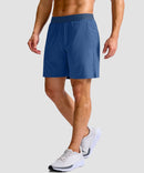 mid rise elastic waist slit short 7" in dusty blue - on model side view