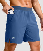 mid rise elastic waist slit short 7" in dusty blue - pocket detail view