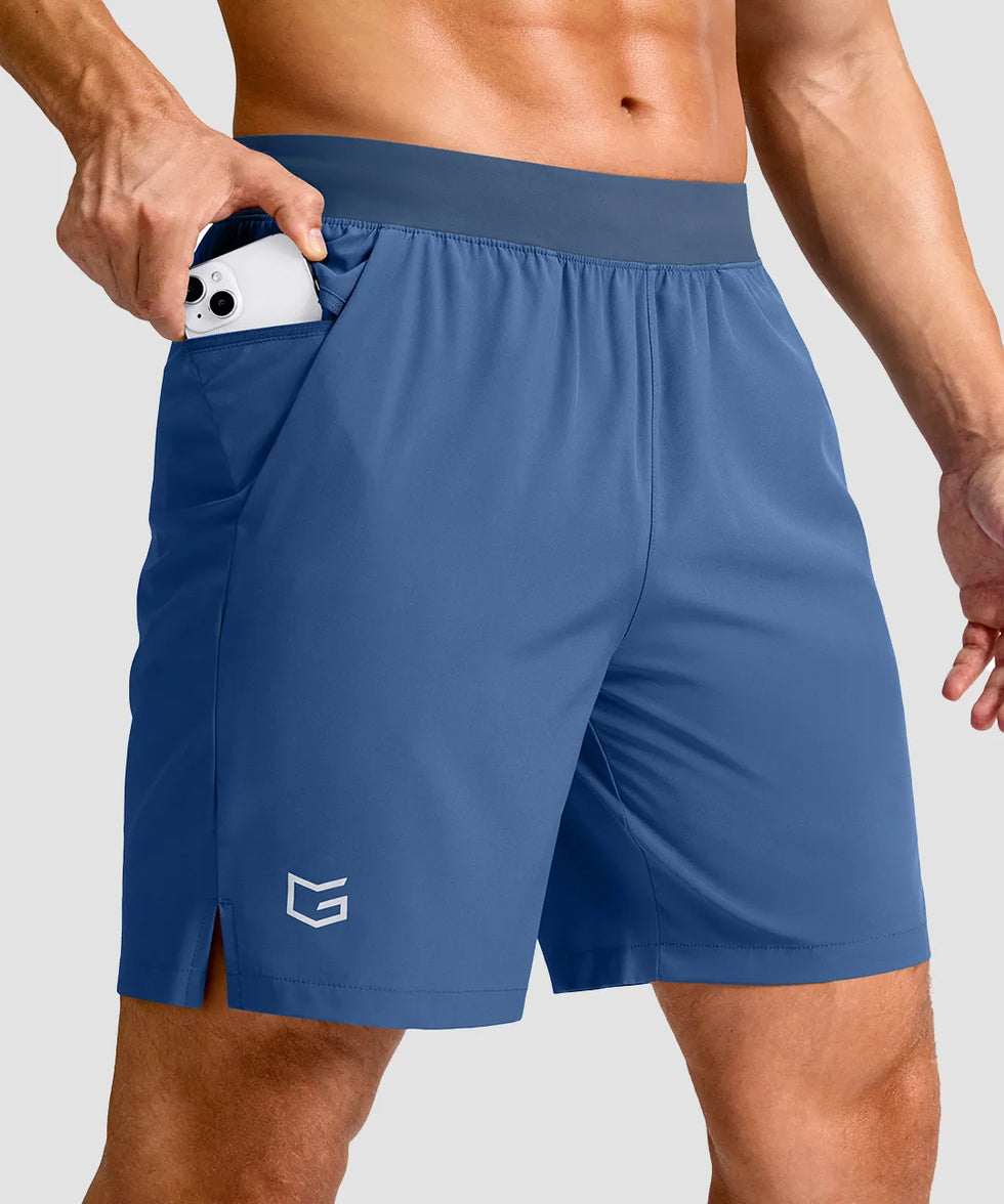 mid rise elastic waist slit short 7" in dusty blue - pocket detail view