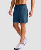 mid rise elastic waist slit short 7" in gray blue - on model side view