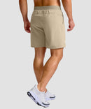 mid rise elastic waist slit short 7" in light khaki - on model back view