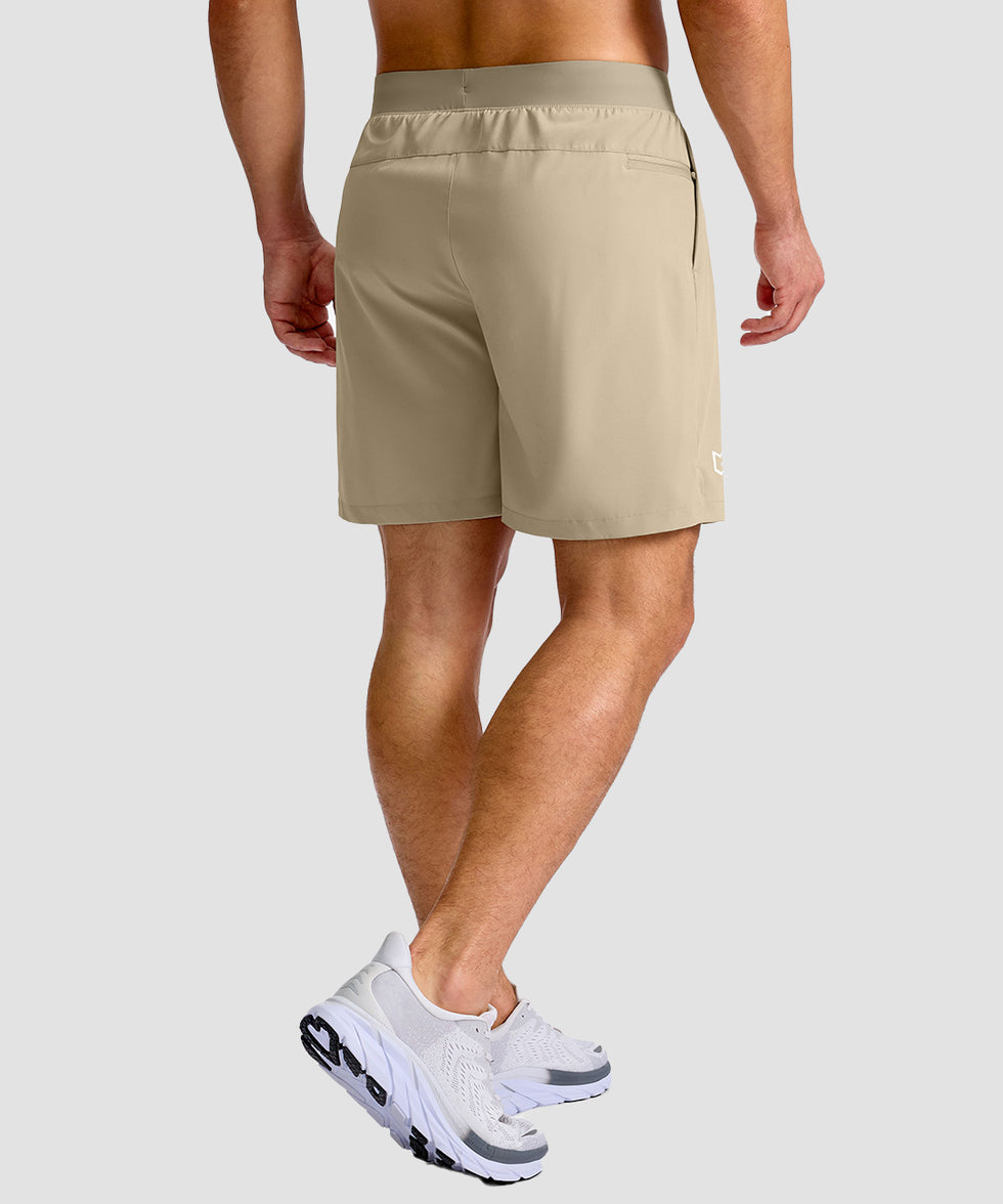 mid rise elastic waist slit short 7" in light khaki - on model back view