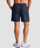 mid rise elastic waist slit short 7" in navy - on model back view