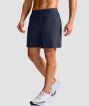 mid rise elastic waist slit short 7" in navy - on model side view