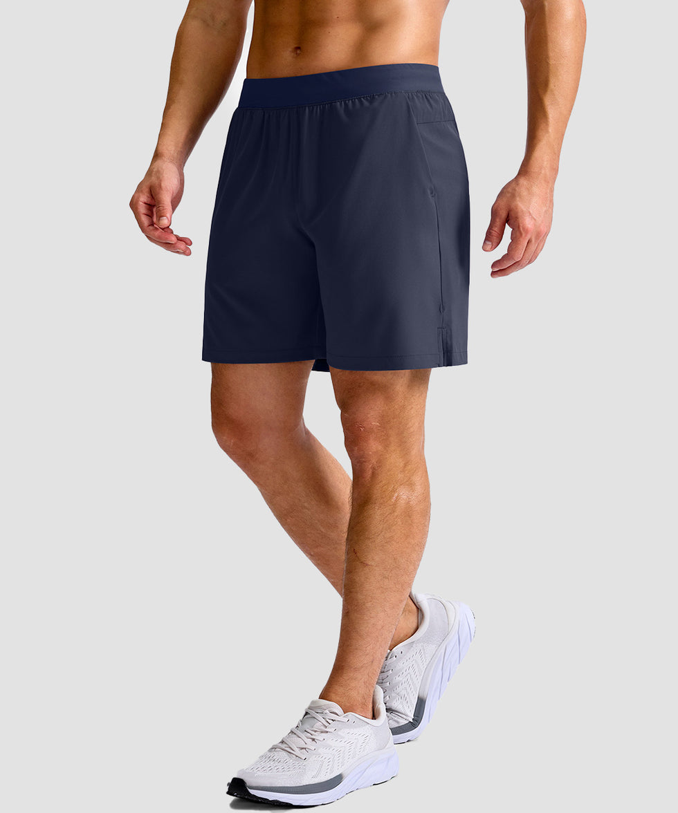 mid rise elastic waist slit short 7" in navy - on model side view