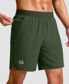 mid rise elastic waist slit short 7" in olive green - front view