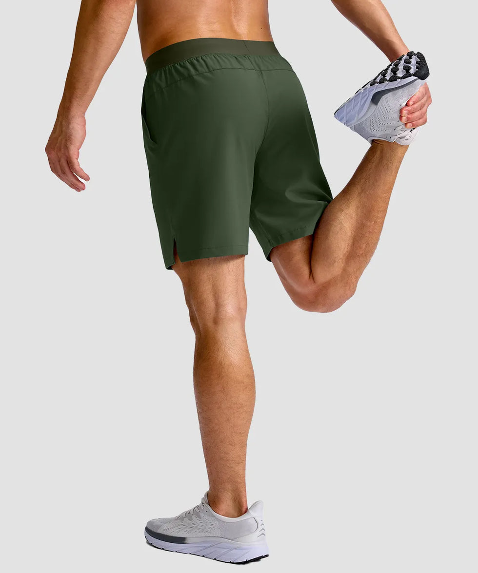 mid rise elastic waist slit short 7" in olive green - on model back view