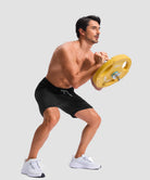 moisture wicking athletic sweat shorts in black - on model exercise view