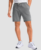 moisture wicking athletic sweat shorts in heather light gray - on model front view