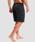 quick dry 9" pocketed board shorts in black - on model back view