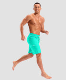 quick dry 9" pocketed board shorts in cyan - on model view