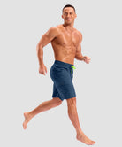 quick dry 9" pocketed board shorts in dark blue - on model view