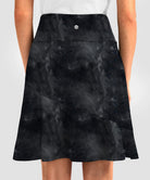 ruffle modest golf skort in black tie-dye - back view