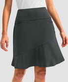 ruffle modest golf skort in dark grey - pocket details view