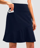 ruffle modest golf skort in navy - pocket details view