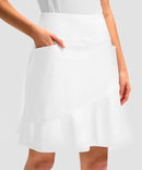 ruffle modest golf skort in white - pocket details view