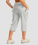 women's 3 zipper pockets hiking capri pants in bright gray - back view